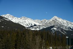 29A Mystic Peak And Mount Ishbel With Moon Afternoon From Trans Canada Highway Driving Between Banff And Lake Louise in Winter.jpg